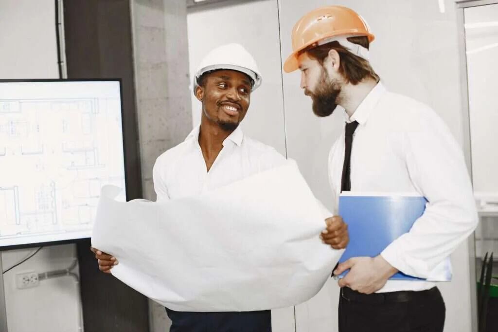 contractor sales team reviewing a reach and frequency call schedule on a whiteboard