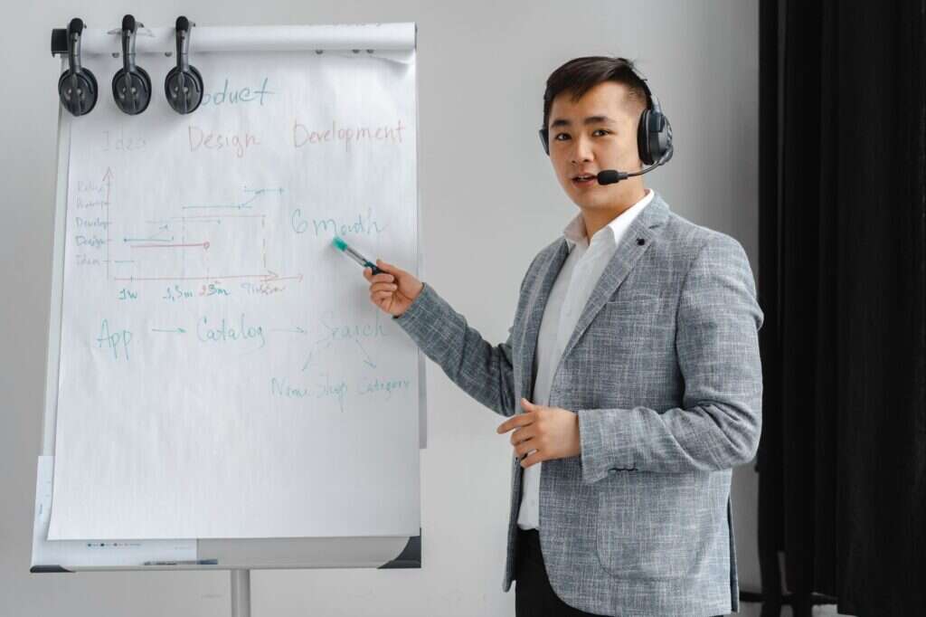 Sales coach reviewing call recordings during 1-on-1 sales coaching session with contractor rep