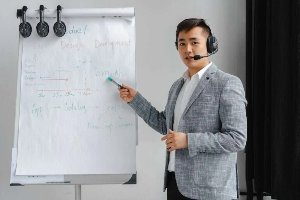 Sales coach reviewing call recordings during 1-on-1 sales coaching session with contractor rep